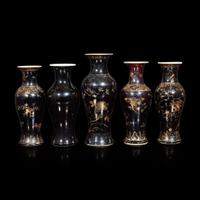 A group of five assorted Chinese "Mirror-black"-glazed porcelain baluster vases Three with apocryphal six-character Kangxi marks