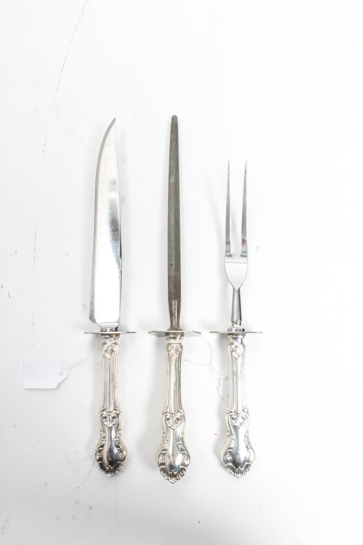 An American Three-Piece Carving Set, Frank M. Whiting & Co., North Attleboro, MA, Georgian Shell pattern, comprising a carving knife, a