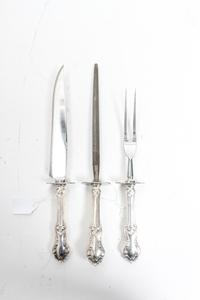 An American Three-Piece Carving Set, Frank M. Whiting & Co., North Attleboro, MA, Georgian Shell pattern, comprising a carving knife, a