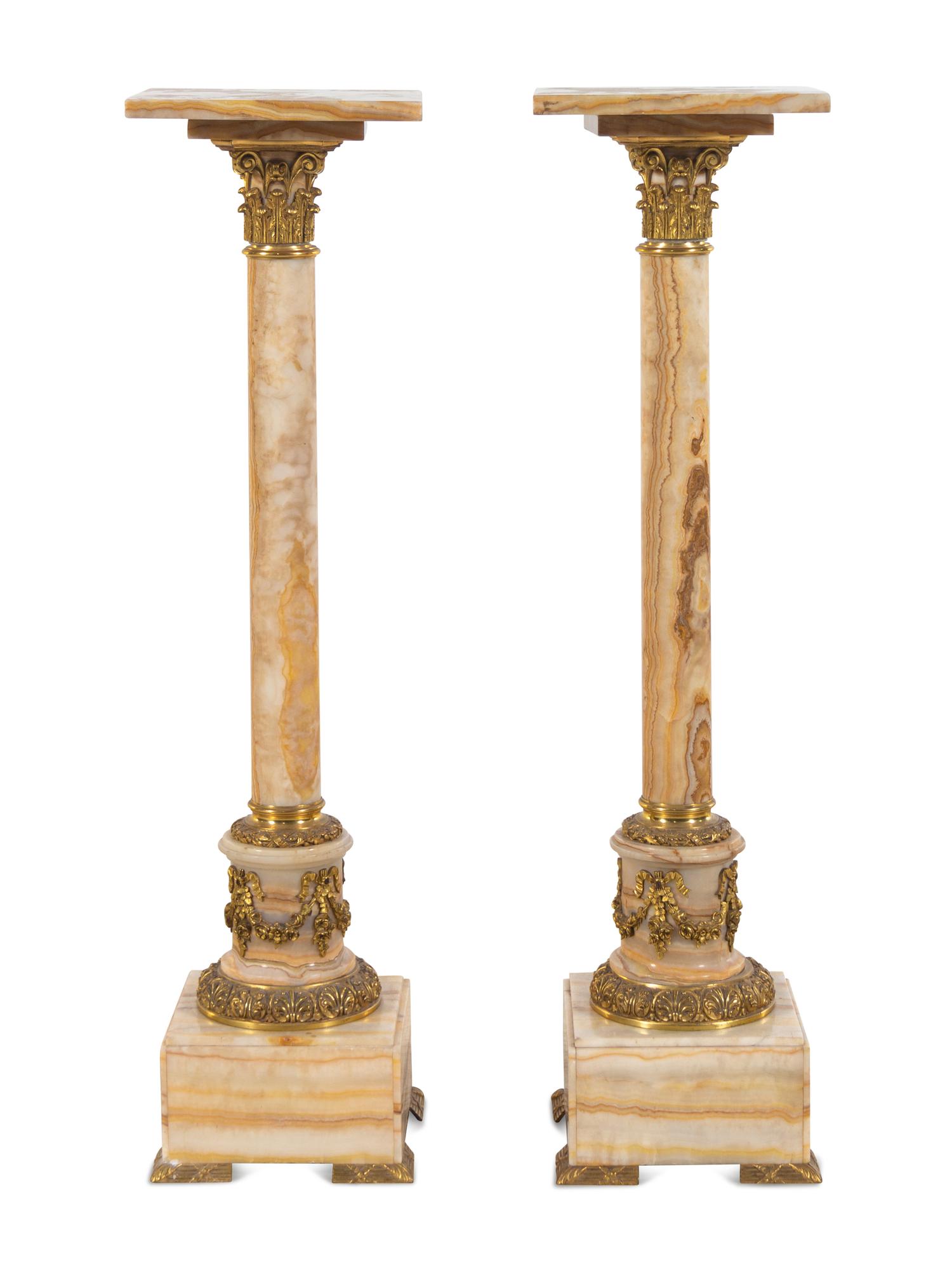 A Pair of French Gilt Bronze Mounted Onyx Pedestals