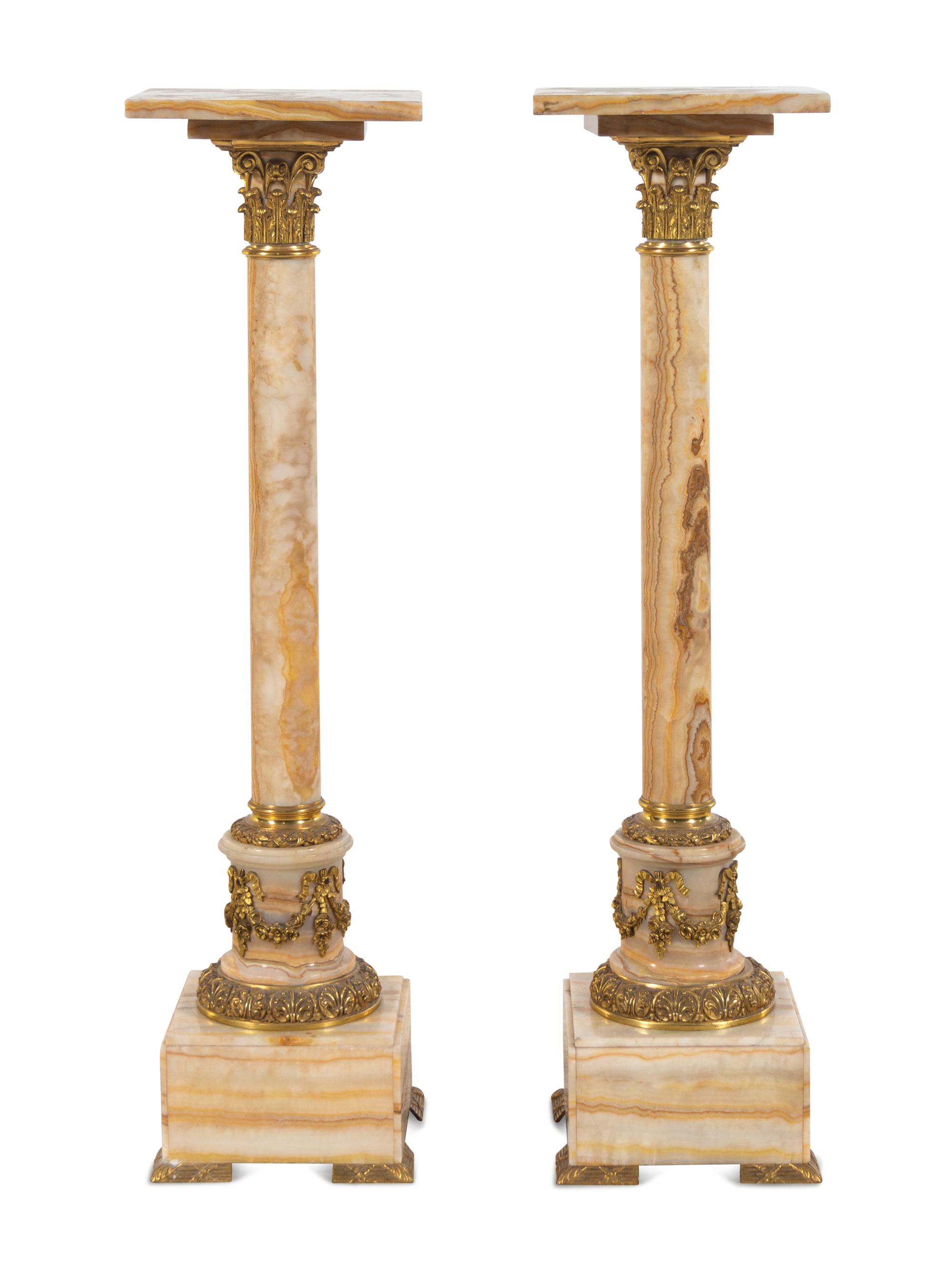 A Pair of French Gilt Bronze Mounted Onyx Pedestals