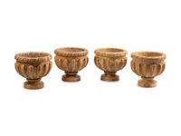 A Set of Four Louis XVI Style Carved Granite Jardinières