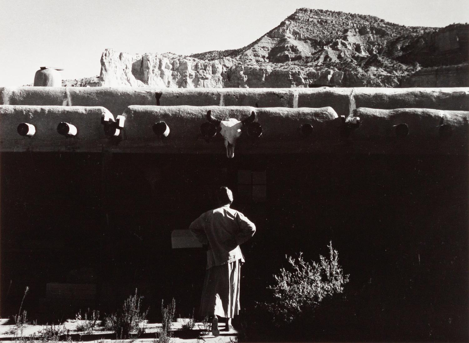 A group of four photographs ( O'Keeffe, Glen Canyon , 1961 (printed 1984); Georgia O'Keeffe Photographing the Chama River , 1961 (printed 1984); Untitled (O'Keeffe walking towards building) , 1960s; Untitled (O'Keeffe walking from building ), 1959 (printed 1984))