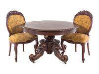A Renaissance Revival Carved Walnut Breakfast Table and Chairs