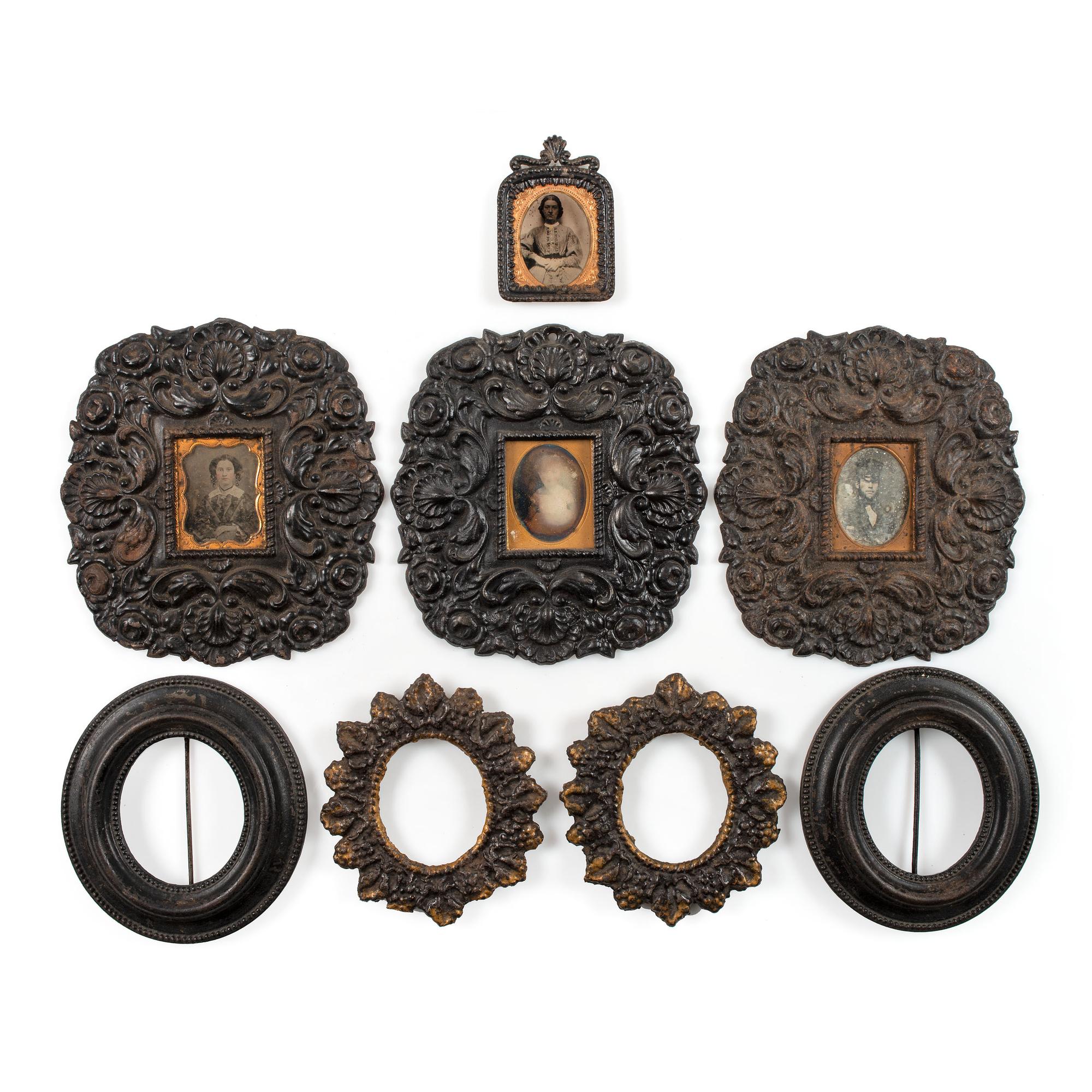[EARLY PHOTOGRAPHY - CASES AND FRAMES]. A group of 8 cast iron wall frames, including: