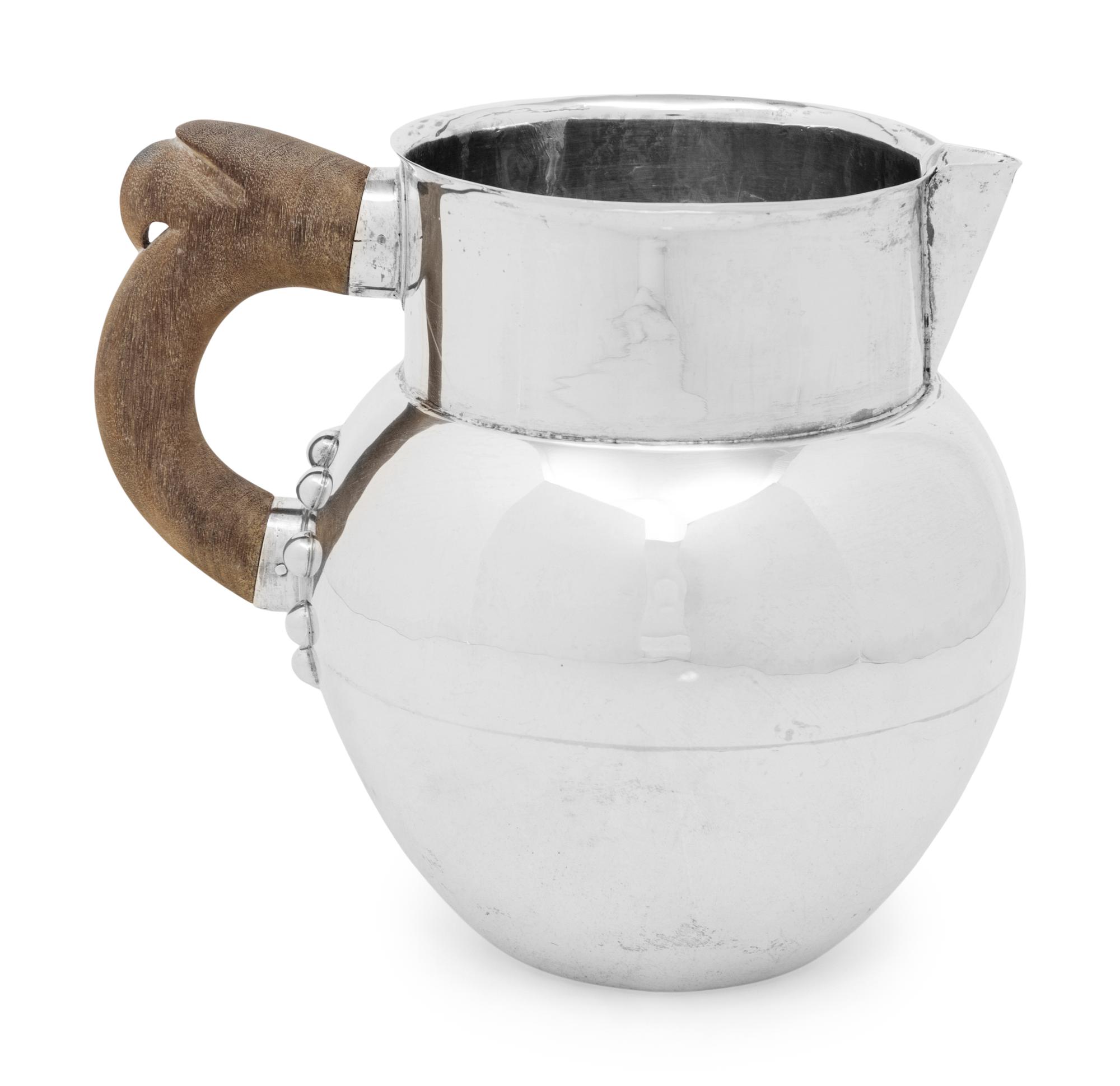 A Mexican Silver Water Pitcher