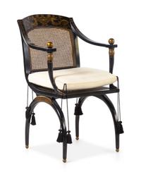 An Italianate Parcel Gilt and Ebonized Armchair — 20TH CENTURY