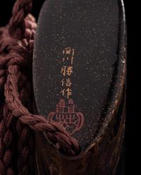A Japanese Gold Decorated Roiro Four-Case Inro