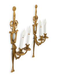 A Pair of Gilt Metal Two-Light Wall Appliques