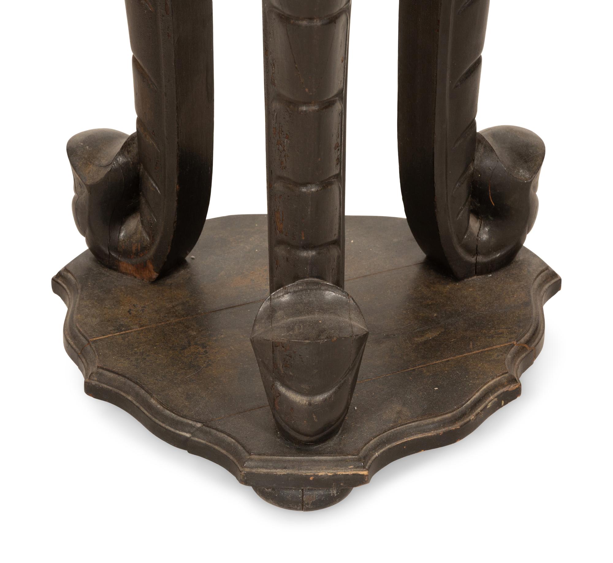 An Anglo-Indian Carved Ebonized Elephant Table