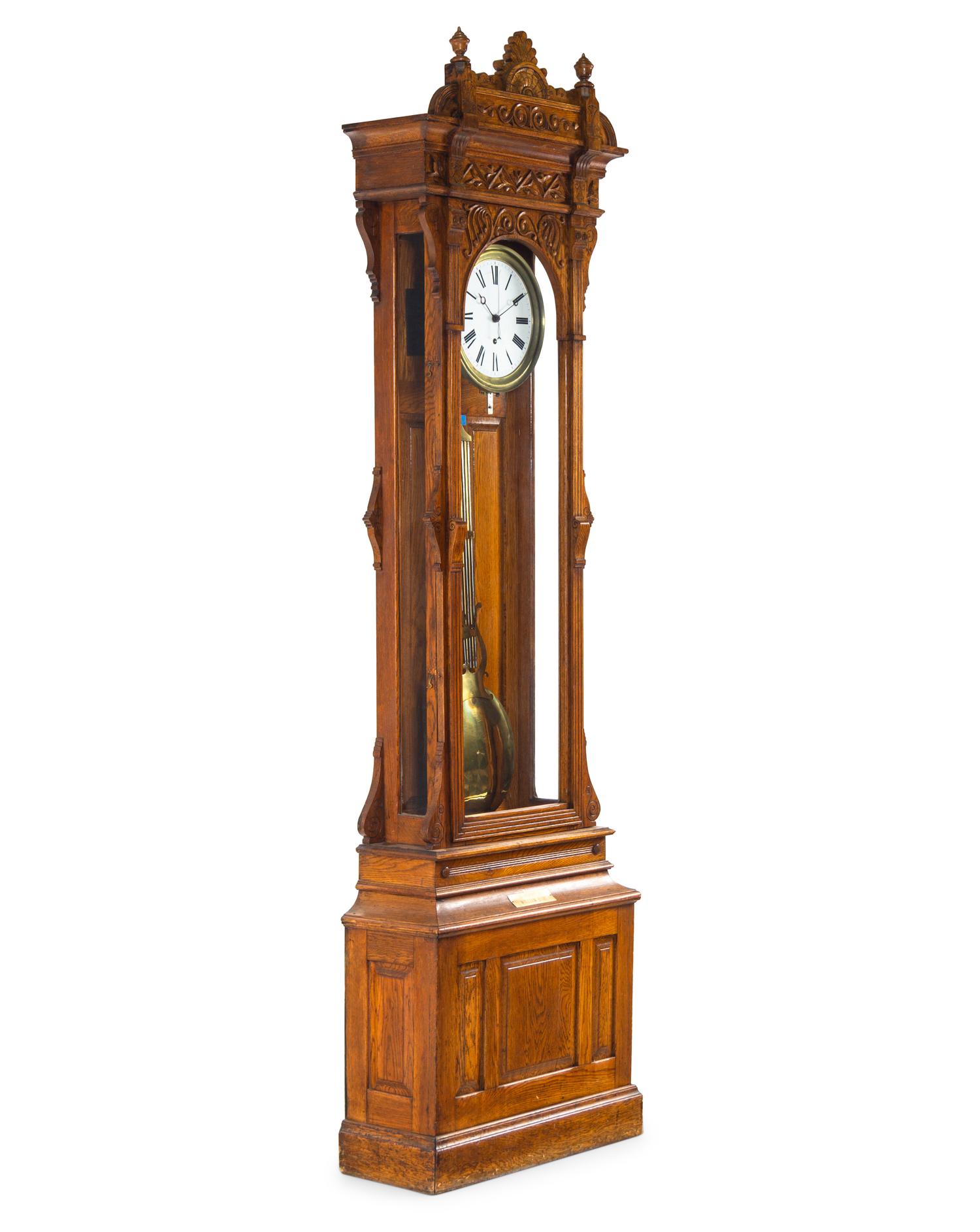 A Victorian Carved Oak Tall Case Clock