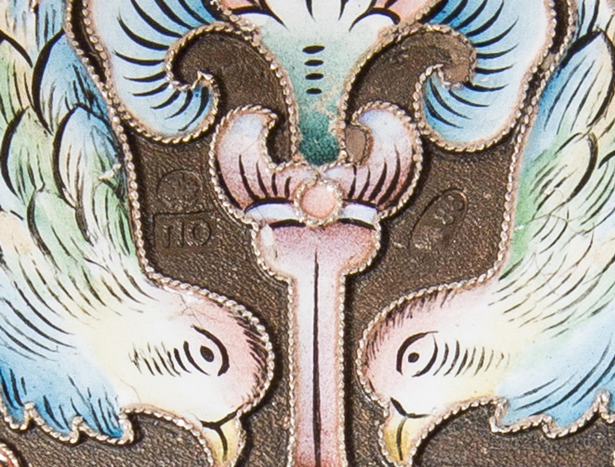 A Russian Silver and Enamel Cigarette Case, Mark of Pavel Ovchinnikov with Imperial warrant, Moscow, the case decorated with polychrome