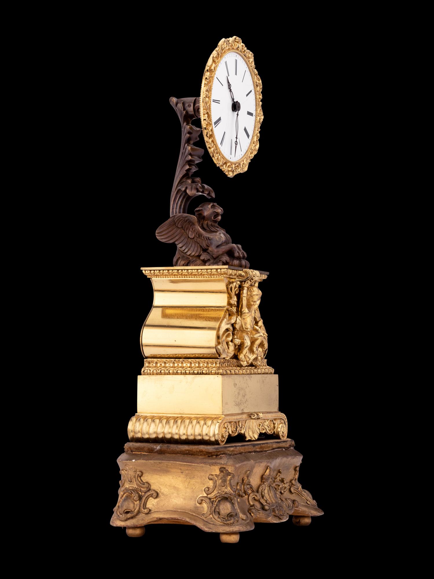 A French Gilt and Patinated Bronze Mystery Clock, with Wood Base, Attributed to Jean Eugene Robert Houdin