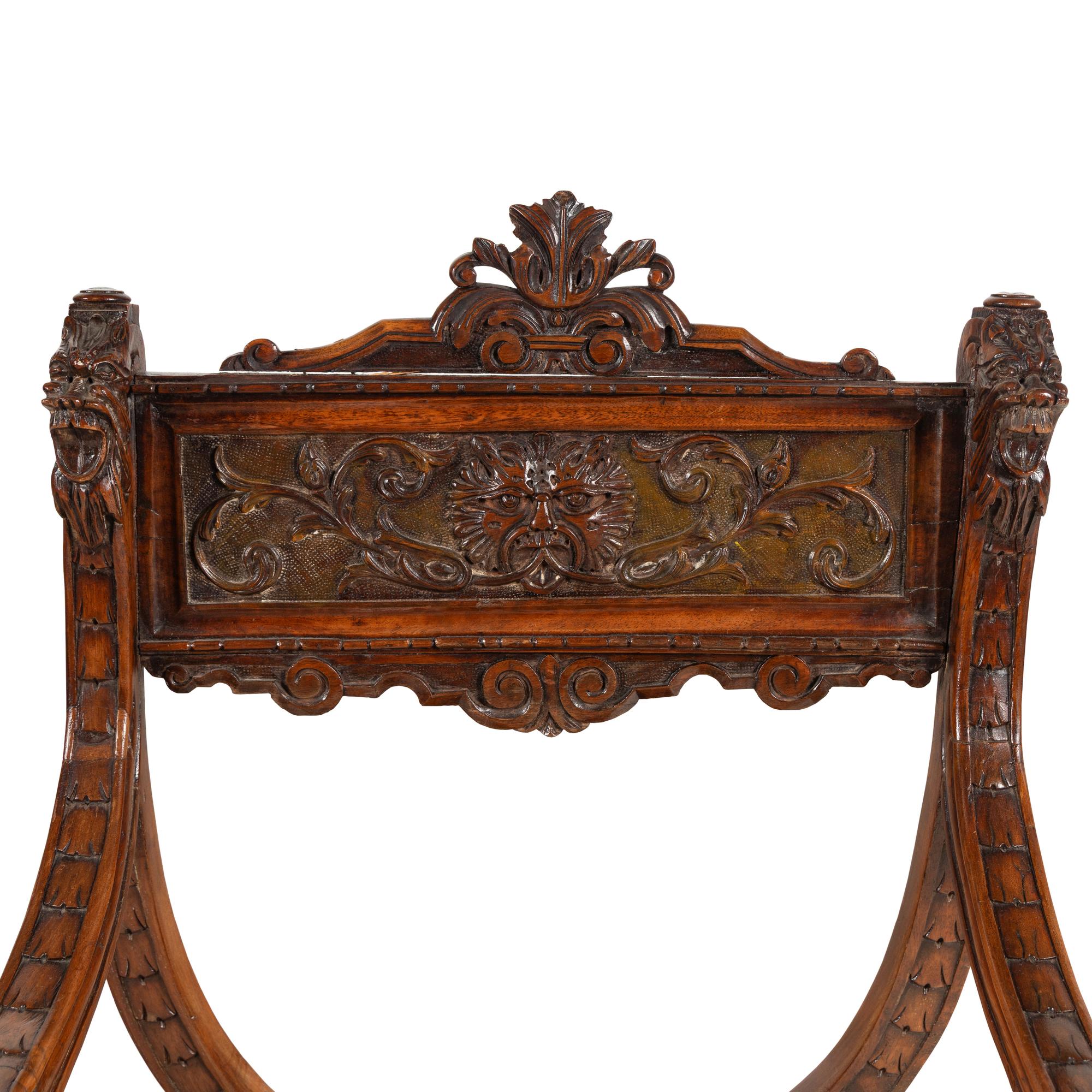 A Pair of Italian Carved Walnut Savonarola Chairs