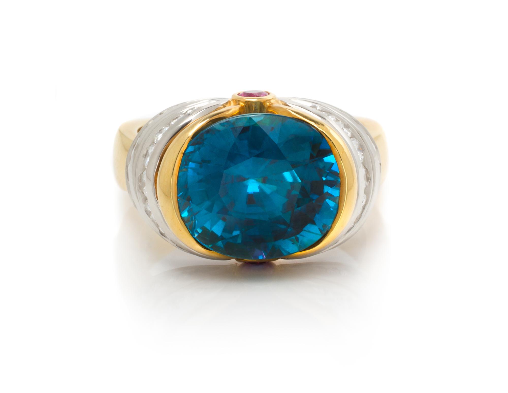 An 18 Karat Yellow Gold, Platinum, Blue Zircon, Diamond, and Pink Sapphire Ring, Krementz, 10.00 dwts.