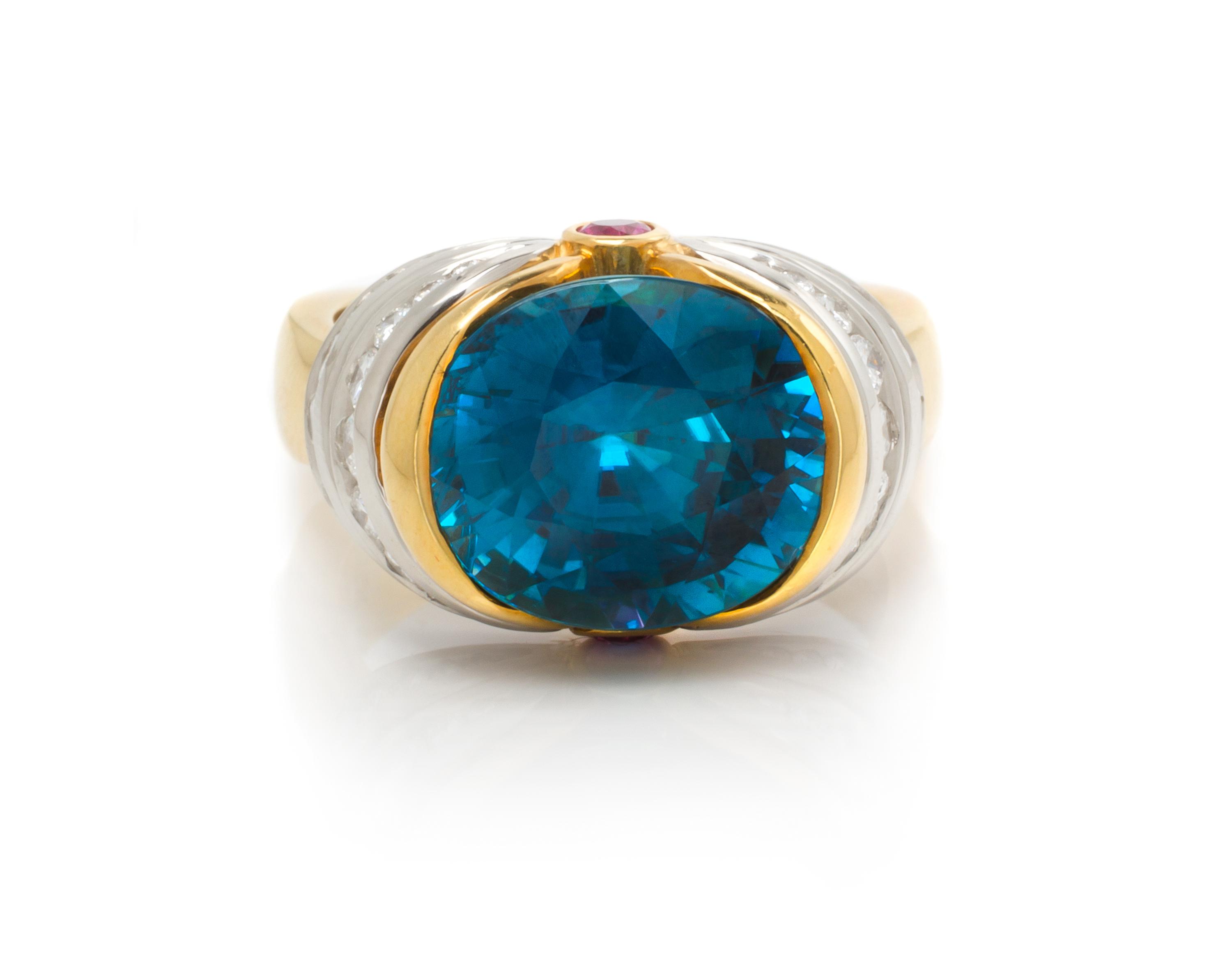 An 18 Karat Yellow Gold, Platinum, Blue Zircon, Diamond, and Pink Sapphire Ring, Krementz, 10.00 dwts.