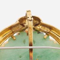 An eighteen karat gold, jade, and diamond pendant/brooch, Keil