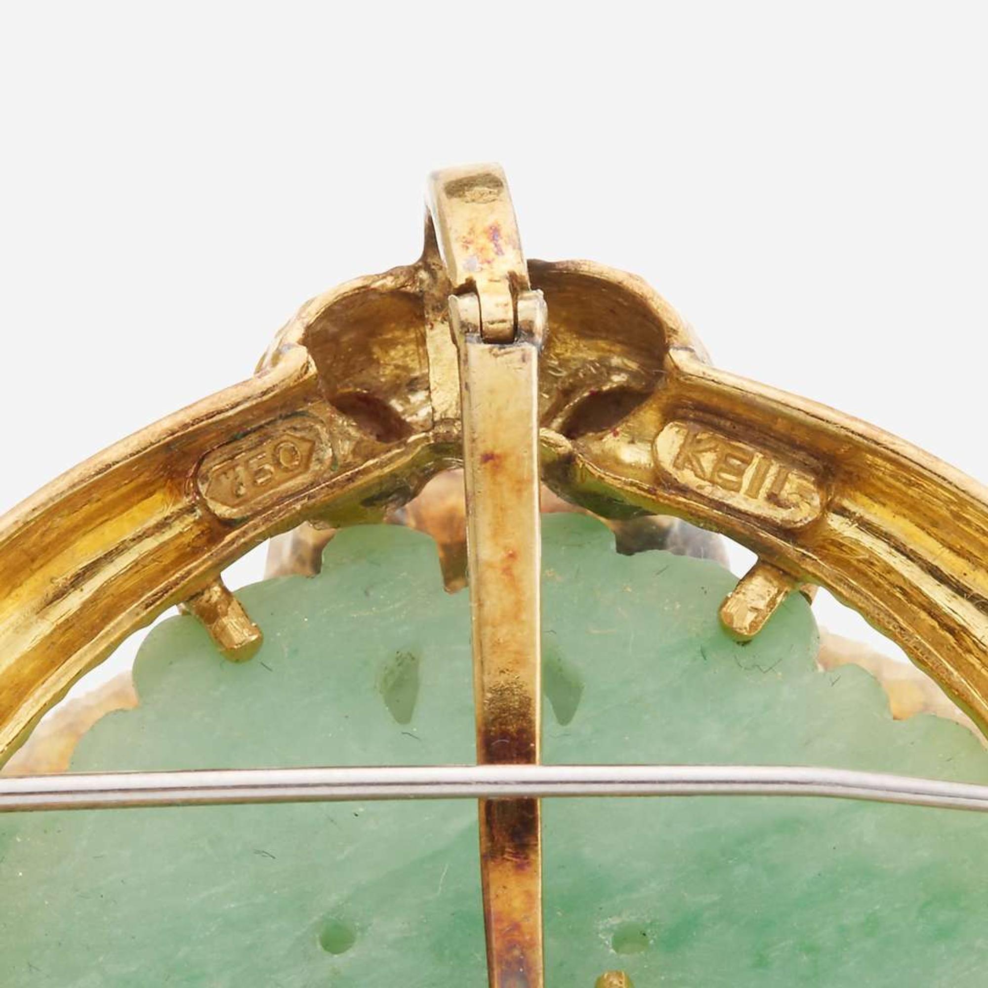 An eighteen karat gold, jade, and diamond pendant/brooch, Keil