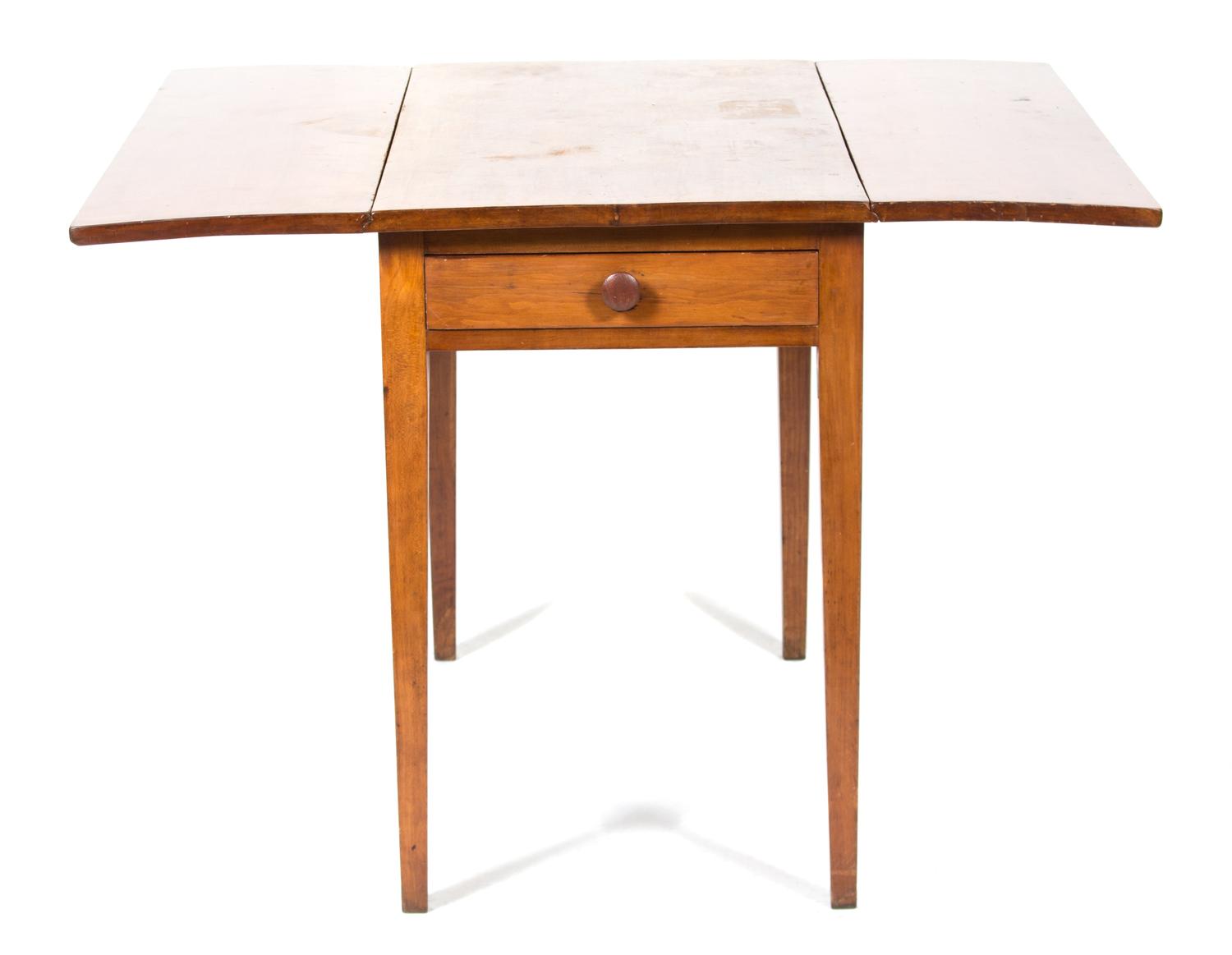 A Walnut Drop Leaf Table Height 28 1/2 x width with leaves up 40 x depth 35 inches. — 20TH CENTURY
