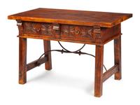 A Spanish Renaissance Revival Wrought Iron Mounted Oak Table
