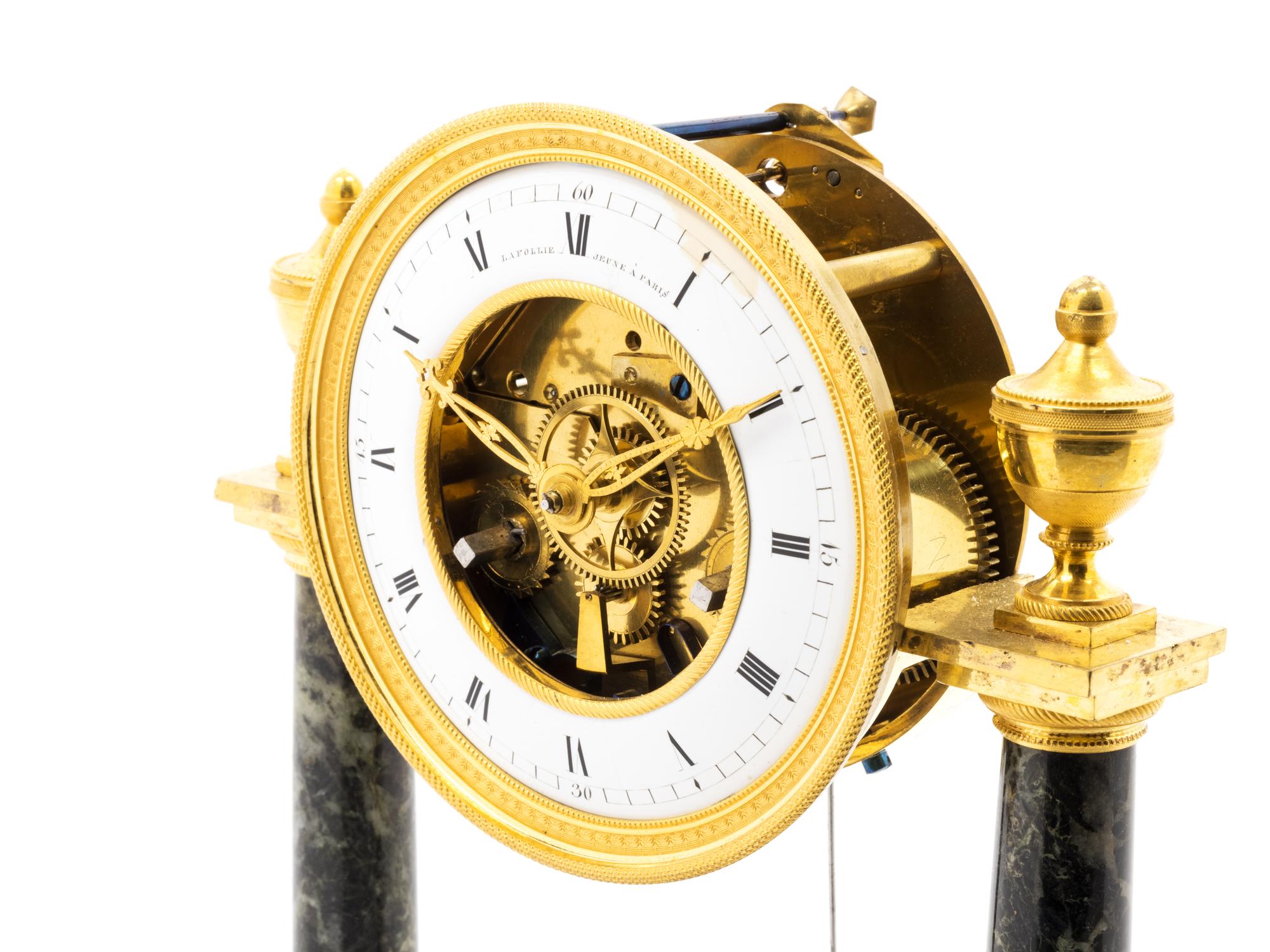 A Directoire Gilt Bronze and Marble Mantel Clock