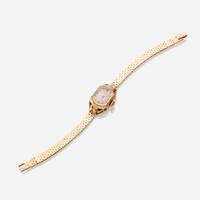 A lady's eighteen karat gold watch with later added fourteen karat gold bracelet, Patek Philippe circa 1940's