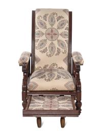 A Mahogany Reclining Armchair with Pull-Out Footrest