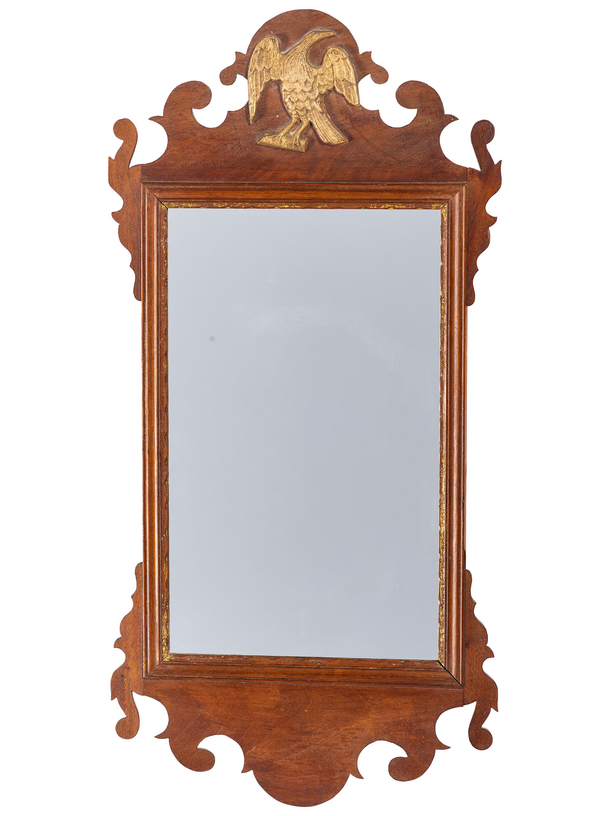 A Chippendale Carved and Parcel Gilt Mahogany Eagle-Decorated Looking Glass