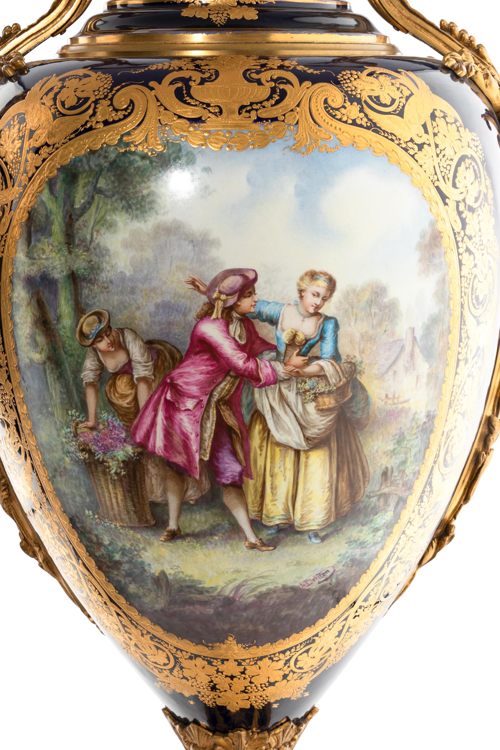 A Pair of Gilt Bronze Mounted Sèvres Style Porcelain Urns