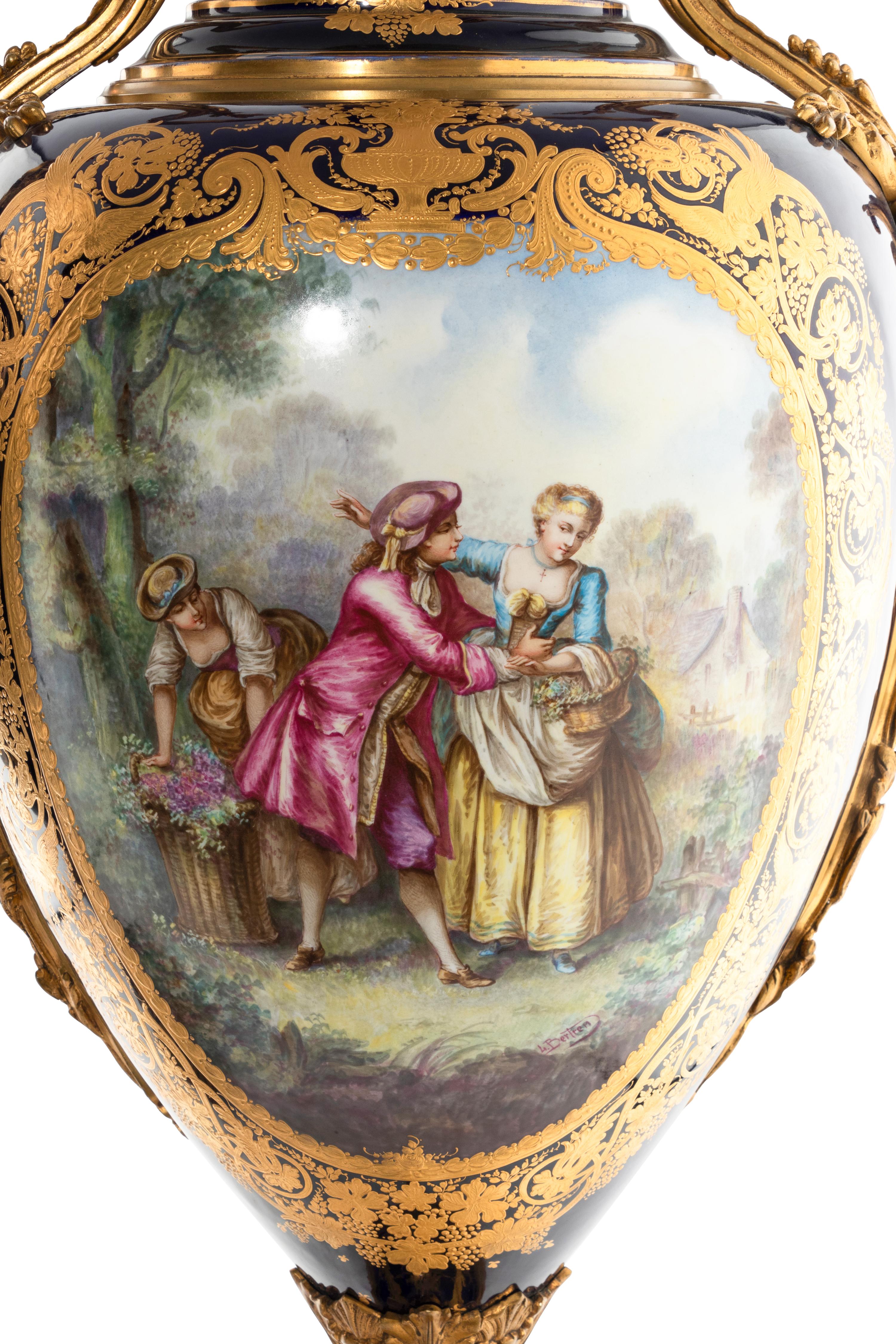A Pair of Gilt Bronze Mounted Sèvres Style Porcelain Urns