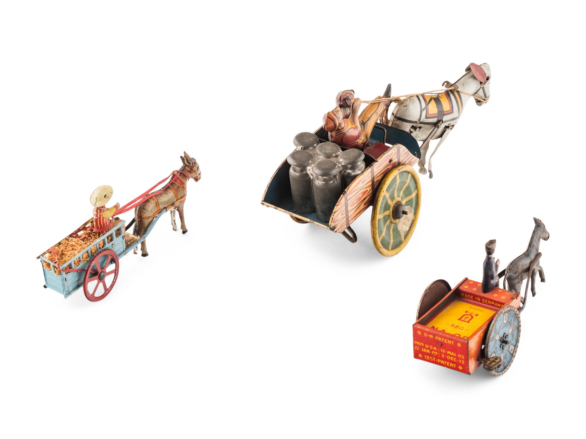 A Group of Three Tin Lithograph Donkey Toys