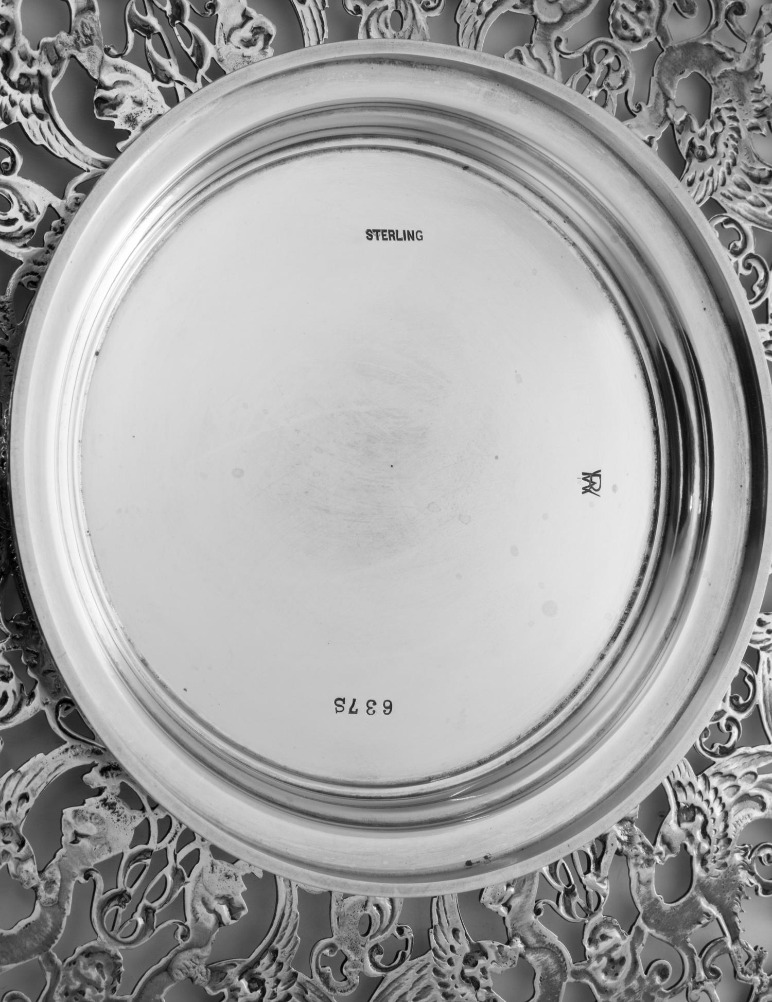 An American Silver Cake Stand, Roger Williams Silver Co., Providence, RI, the border with openwork chimera, dolphin, putto and foliate
