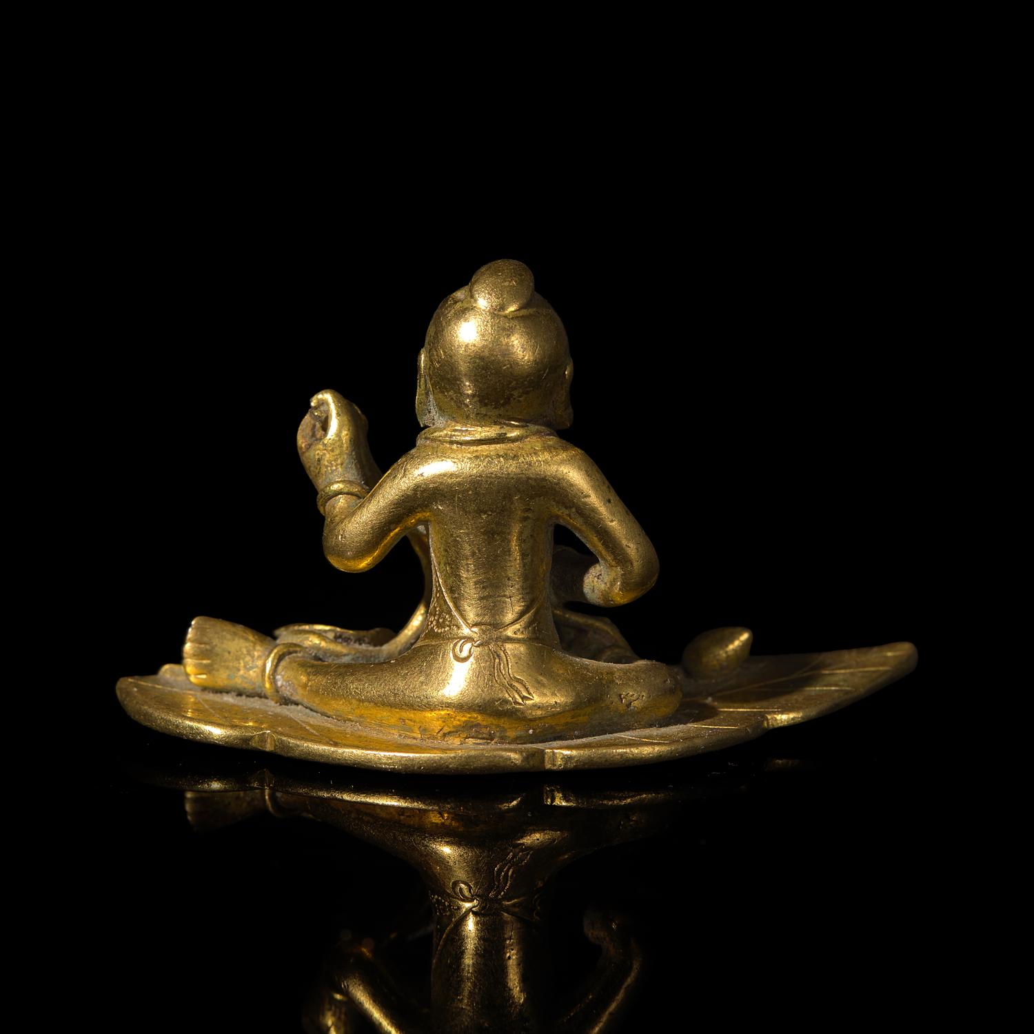 A Small Chinese Bronze Figure of a Boy with Lotus, Qing Dynasty — 清 銅鎏金荷葉童子