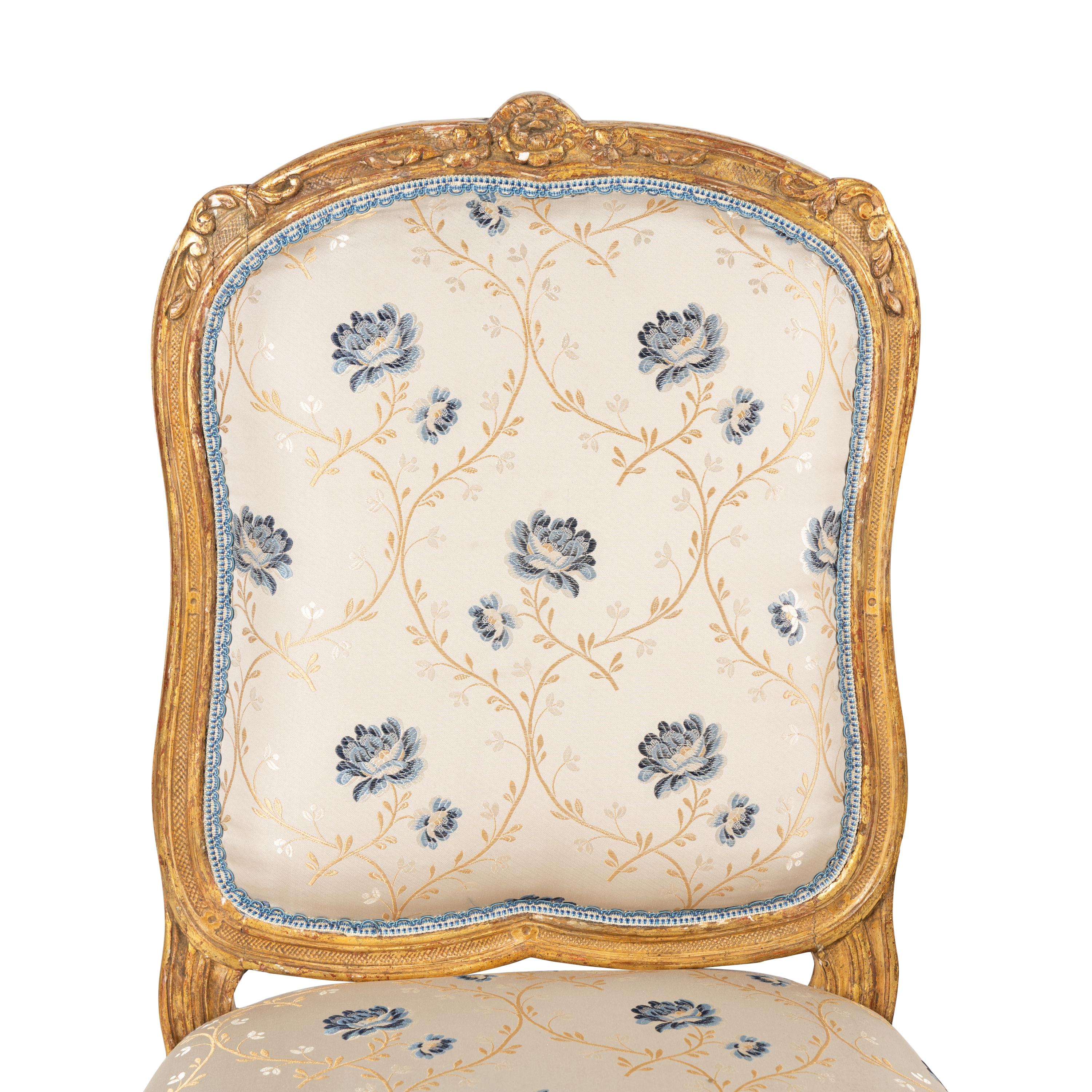 A Pair of Louis XV Carved Giltwood Chaises à la Reine