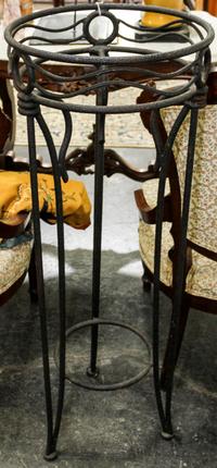 A Wrought Iron Pedestal Table. Height 38 1/2 inches.