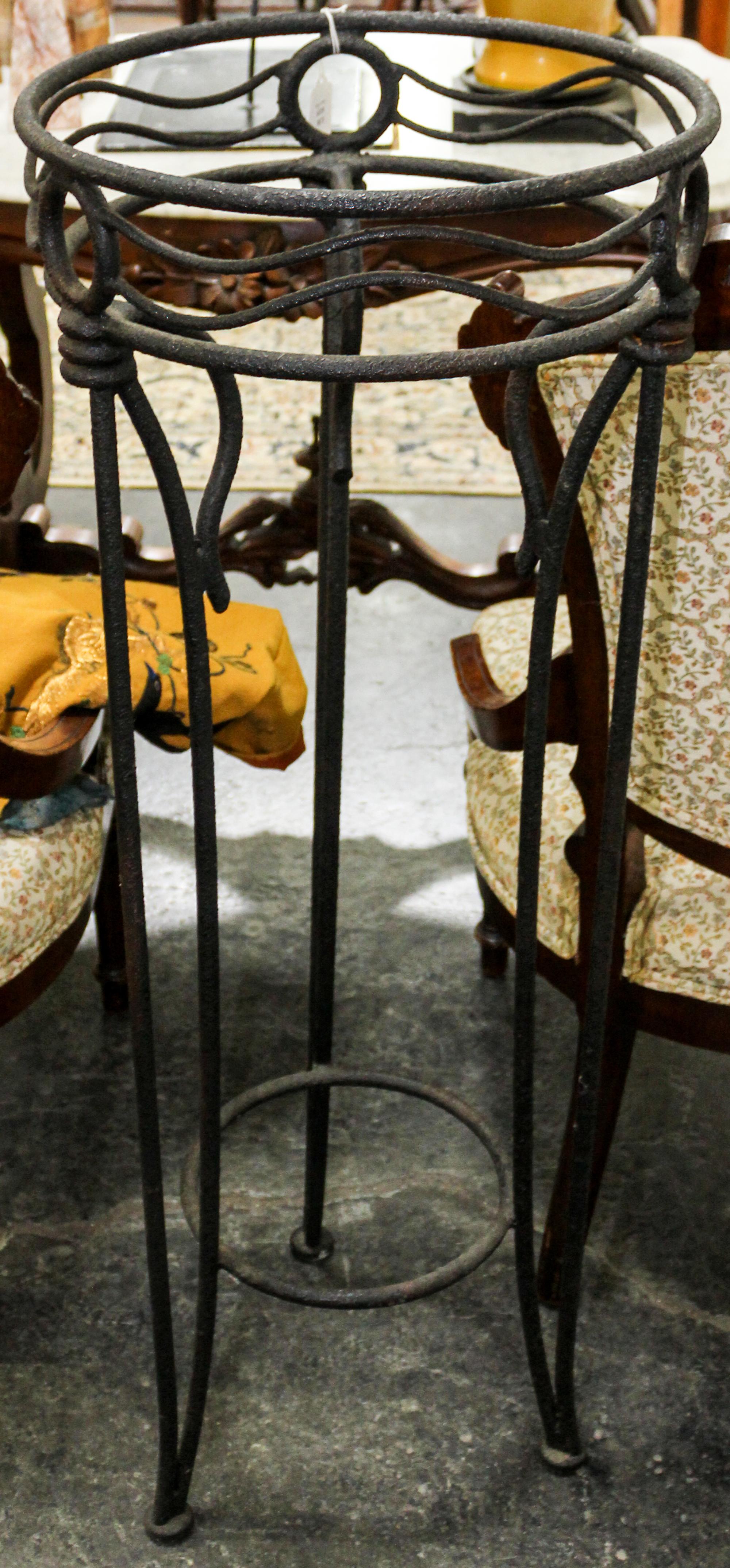 A Wrought Iron Pedestal Table. Height 38 1/2 inches.
