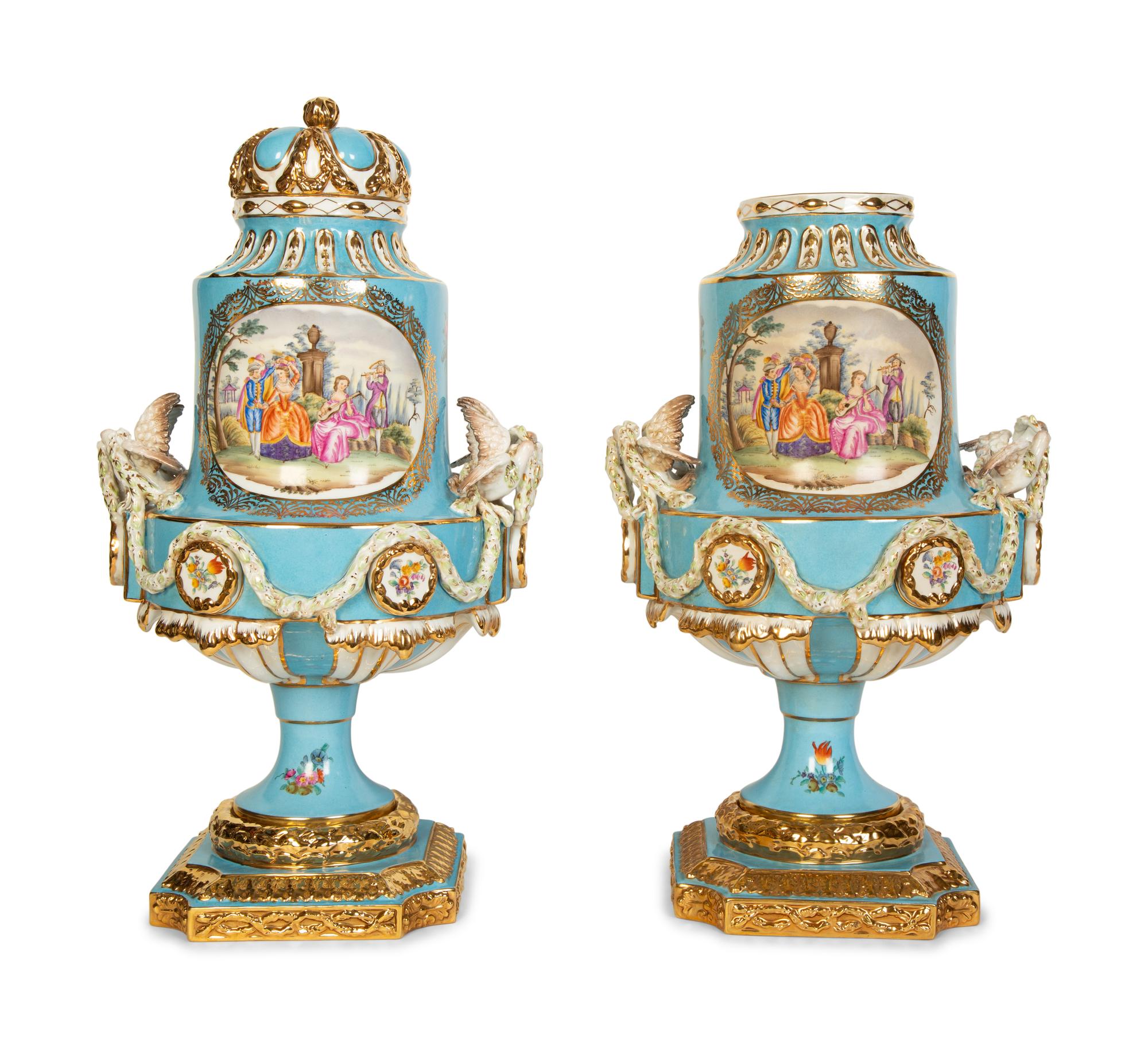 A Pair of Sèvres Style Porcelain Urns
