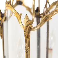 A Pair of Louis XV Style Gilt Bronze Three-Light Hall Lanterns
