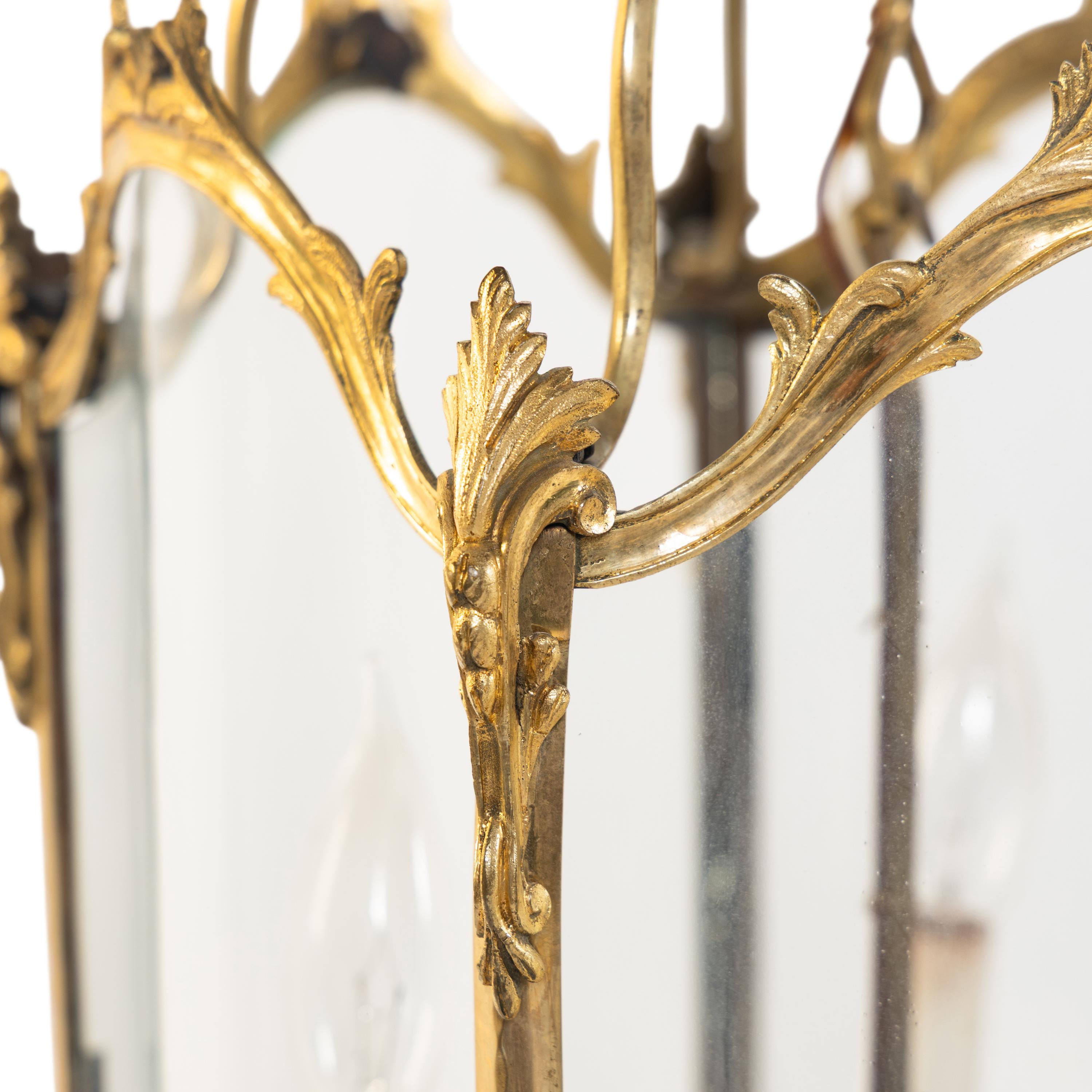 A Pair of Louis XV Style Gilt Bronze Three-Light Hall Lanterns