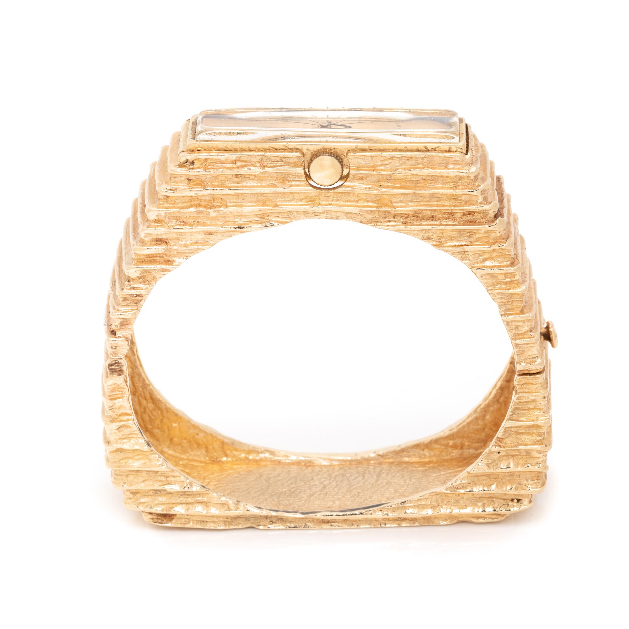 MODERNIST, 14K YELLOW GOLD BANGLE BRACELET WRISTWATCH