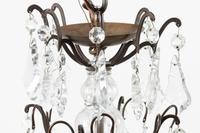 A French Patinated Metal and Cut Glass Eight-Light Chandelier