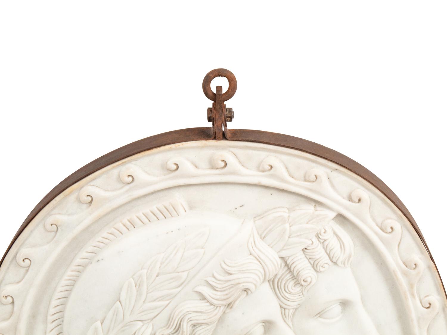 An Italian Iron-Mounted Marble Profile Medallion