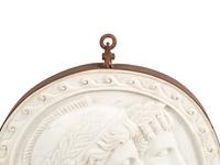 An Italian Iron-Mounted Marble Profile Medallion