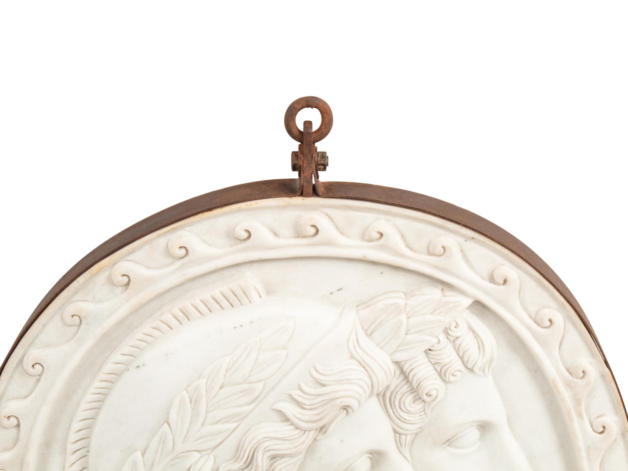 An Italian Iron-Mounted Marble Profile Medallion