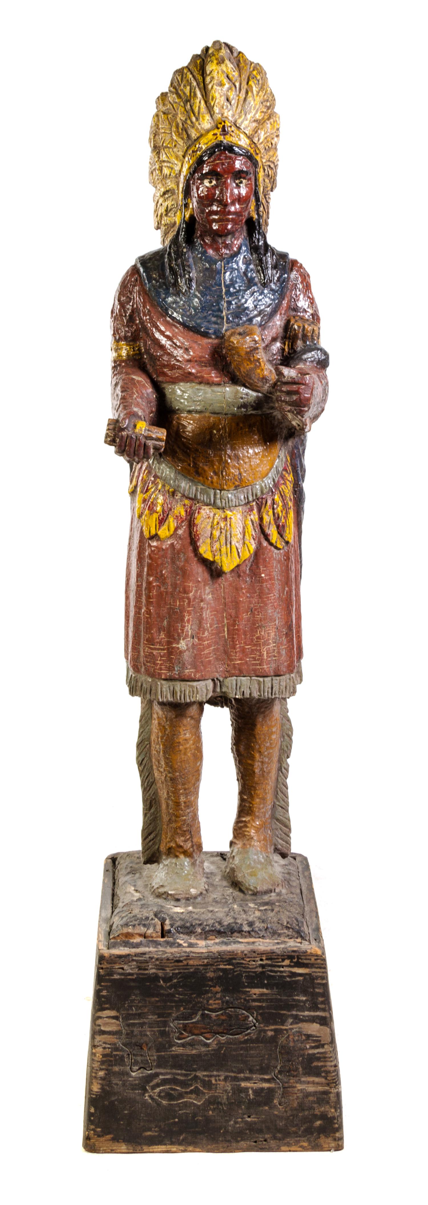 A Carved and Polychrome Painted Cigar Store Indian Height overall 71 inches. — EARLY 20TH CENTURY