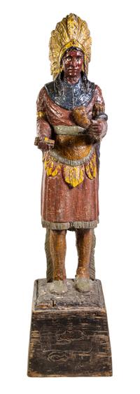 A Carved and Polychrome Painted Cigar Store Indian Height overall 71 inches. — EARLY 20TH CENTURY