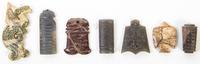 A Group of Seven Hardstone and Jade Toggles Height of tallest 3 3/4 inches.