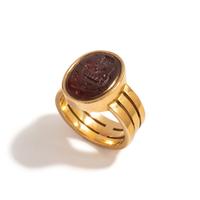 A Carnelian Ring Stone with an Allegorical Scene, After the Antique — Set in a gold ring; Hallmarks stamped on the back