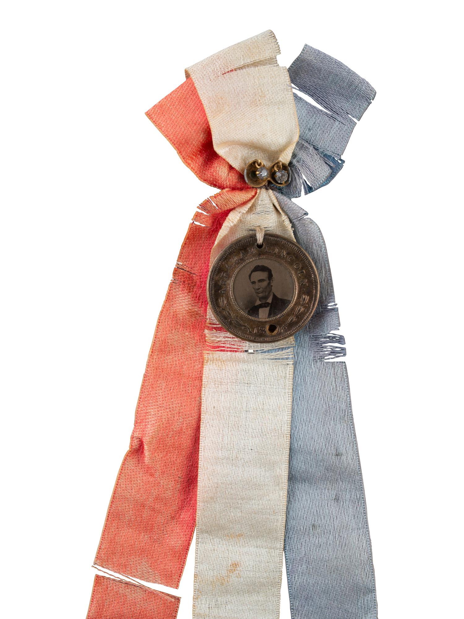 [LINCOLN, Abraham (1809-1865)]. Abraham Lincoln and Hannibal Hamlin back-to-back campaign ferrotype with ribbons. 1860.