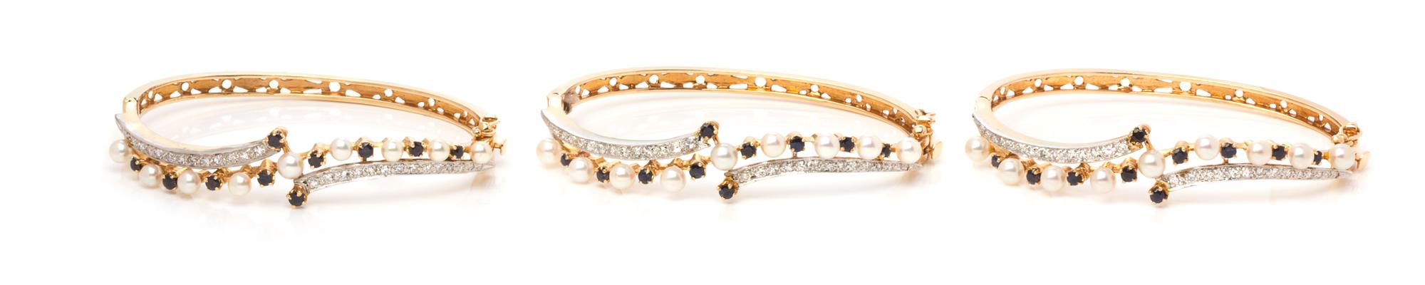 A Collection of Yellow Gold, Cultured Pearl, Diamond and Sapphire Bangles, 30.90 dwts.
